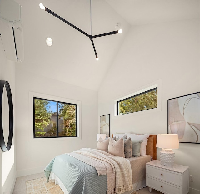 carpeted bedroom with multiple windows, a wall mounted air conditioner, and high vaulted ceiling