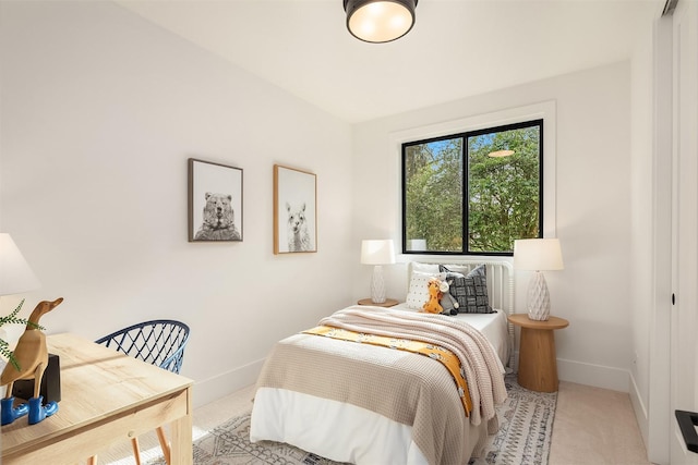 bedroom featuring light carpet