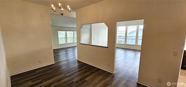 interior space featuring dark hardwood / wood-style flooring and a notable chandelier