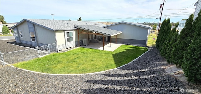 back of property featuring cooling unit, a patio area, and a lawn