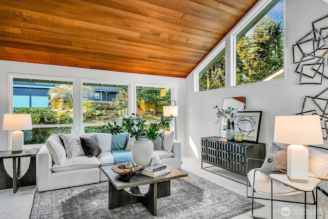 sunroom with lofted ceiling and wooden ceiling