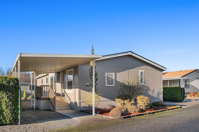 manufactured / mobile home with a carport