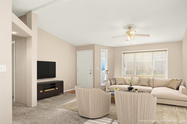 carpeted living room featuring lofted ceiling and ceiling fan