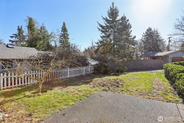 view of yard with a fenced backyard