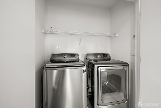 laundry area with separate washer and dryer