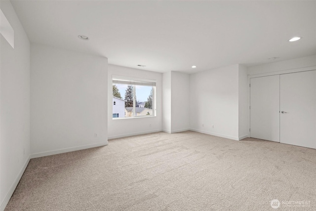 unfurnished bedroom with light carpet