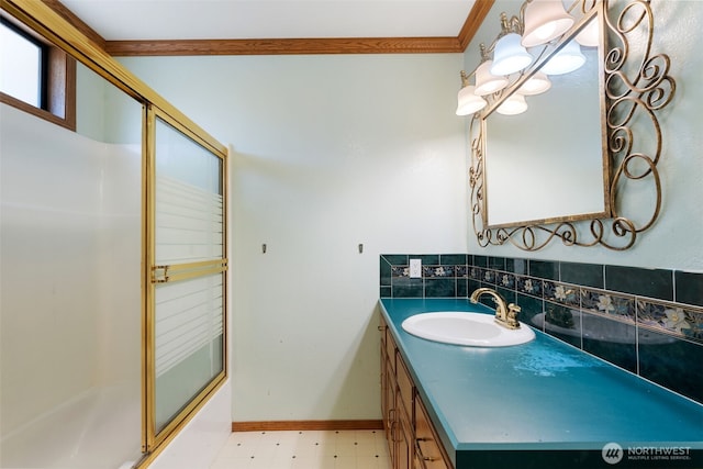 bathroom with bath / shower combo with glass door, ornamental molding, vanity, baseboards, and tile patterned floors