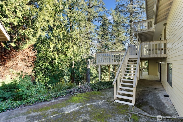 exterior space with stairs and a wooden deck