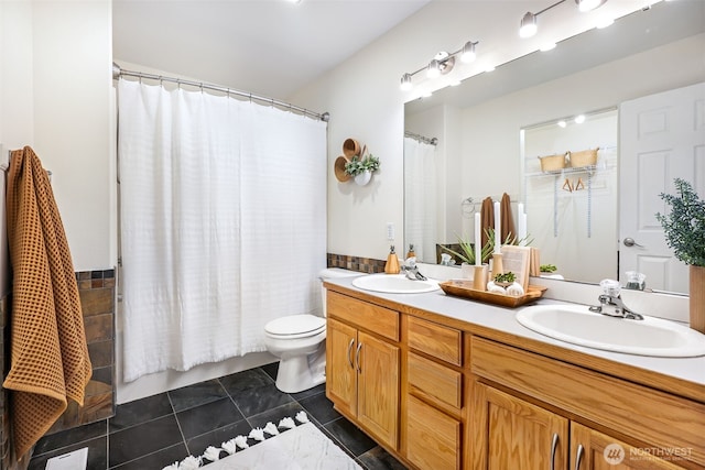 bathroom with tile patterned flooring, vanity, a shower with shower curtain, and toilet