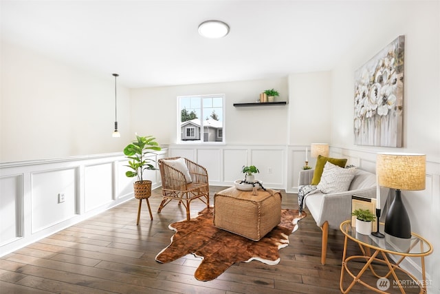 sitting room featuring dark hardwood / wood-style floors