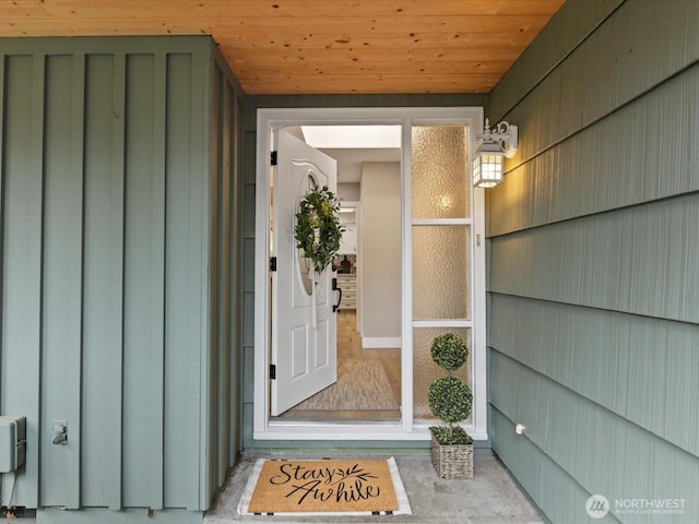 doorway to property featuring board and batten siding