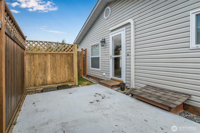 view of patio / terrace with entry steps and fence