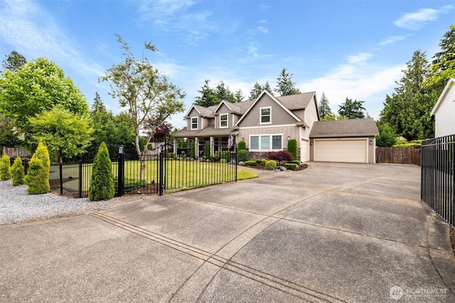 view of front of property featuring a fenced front yard, an attached garage, concrete driveway, a front lawn, and board and batten siding