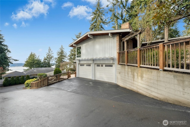 view of side of home featuring a garage