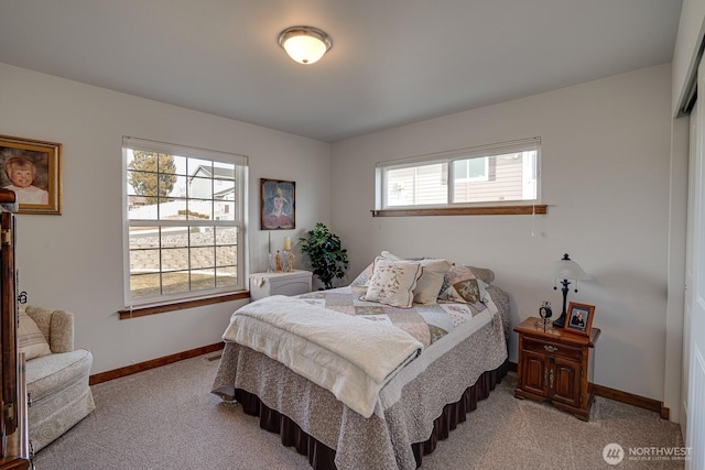 bedroom featuring light carpet