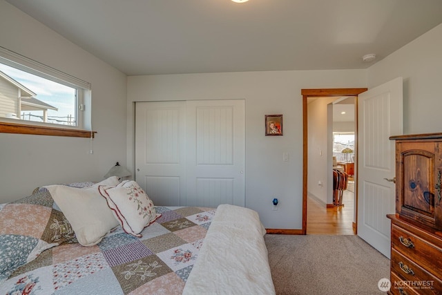 carpeted bedroom featuring a closet