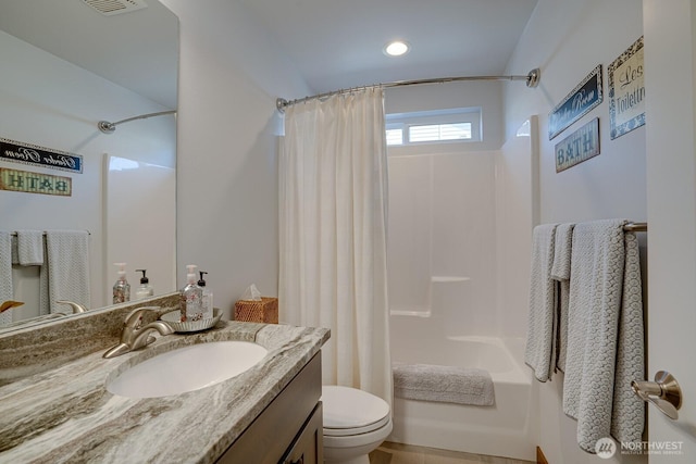 full bathroom featuring vanity, shower / bath combination with curtain, and toilet