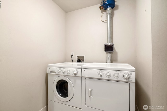 laundry room featuring separate washer and dryer