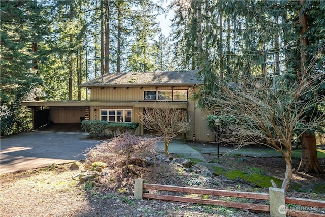 rear view of house with a carport