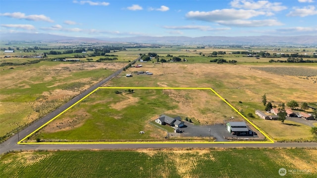 birds eye view of property featuring a rural view and a mountain view