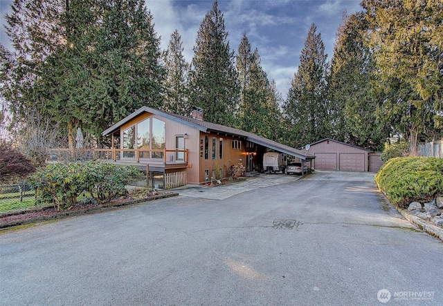 view of front facade with a garage and an outdoor structure