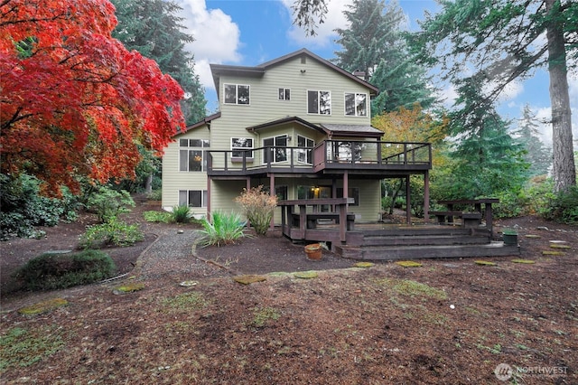 back of property featuring a deck