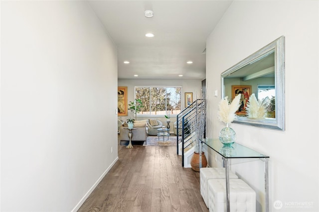 corridor with hardwood / wood-style flooring