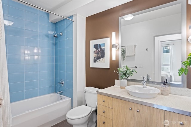 bathroom with toilet, ensuite bath, vanity, and shower / bathing tub combination