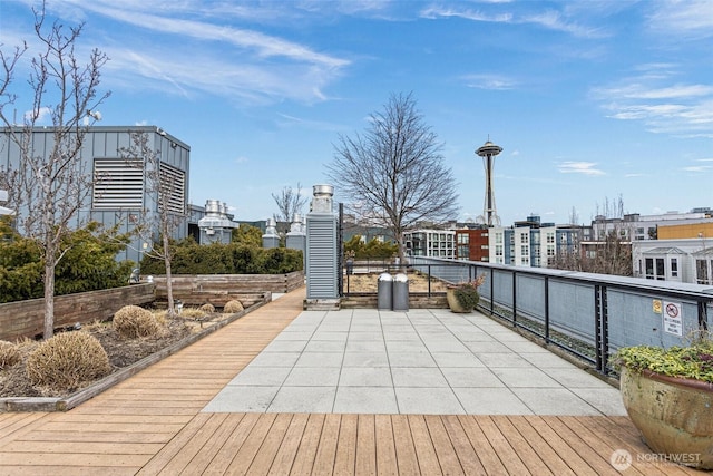 wooden terrace with a city view