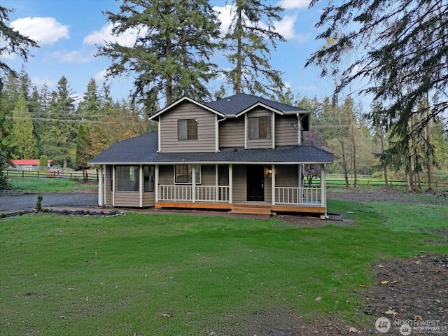 farmhouse inspired home with a front yard