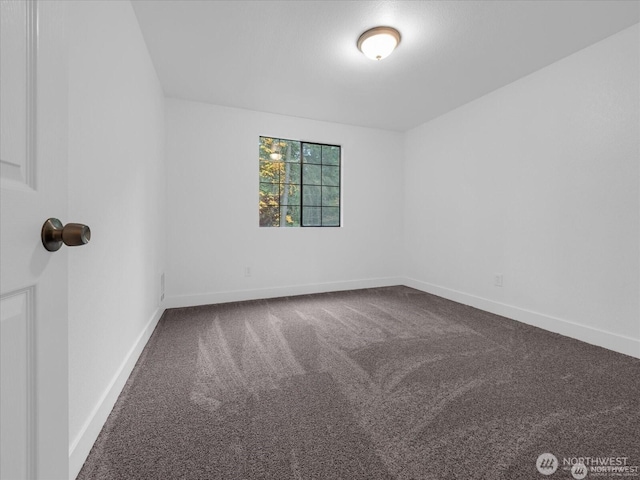 empty room featuring carpet flooring