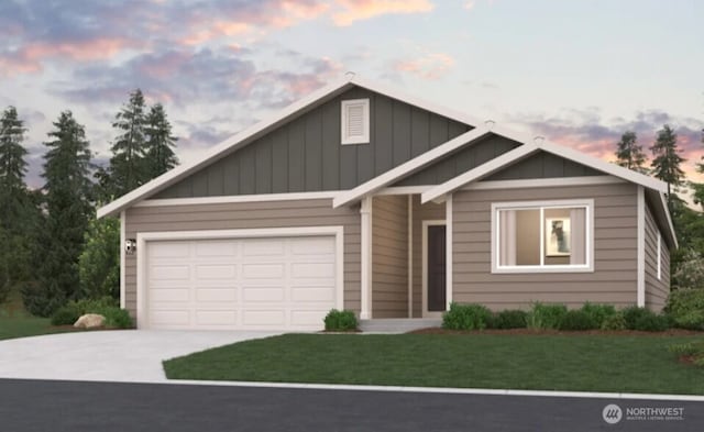 view of front of house with a garage and a lawn