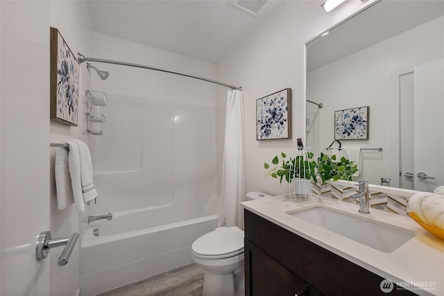 full bathroom featuring vanity, toilet, shower / tub combo, and hardwood / wood-style floors