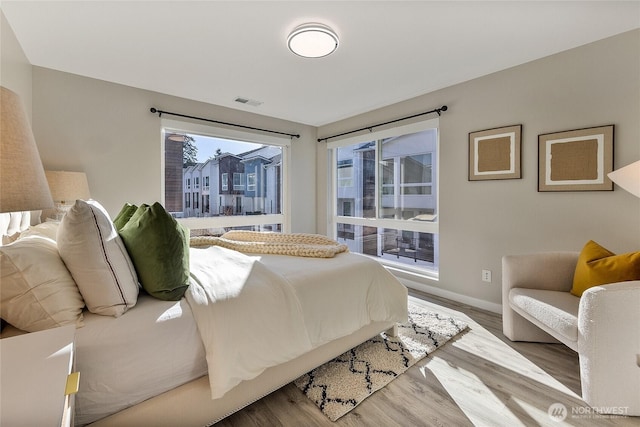 bedroom with light wood-type flooring