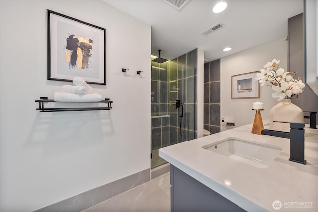 bathroom featuring vanity and a shower with shower door