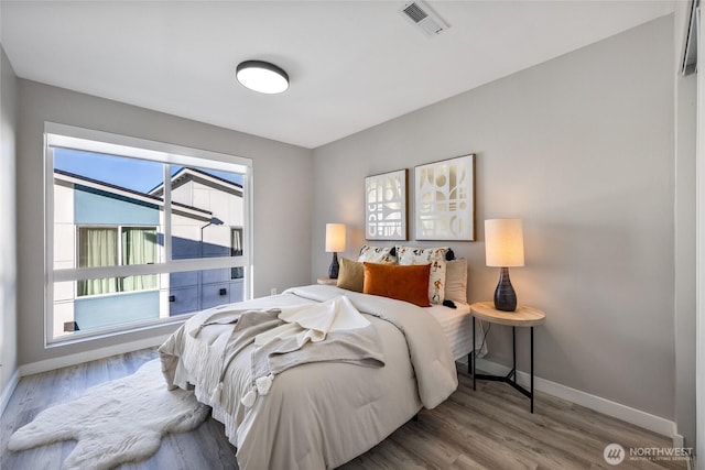 bedroom with light hardwood / wood-style floors