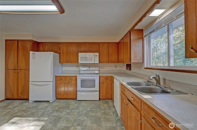 kitchen featuring sink and white appliances