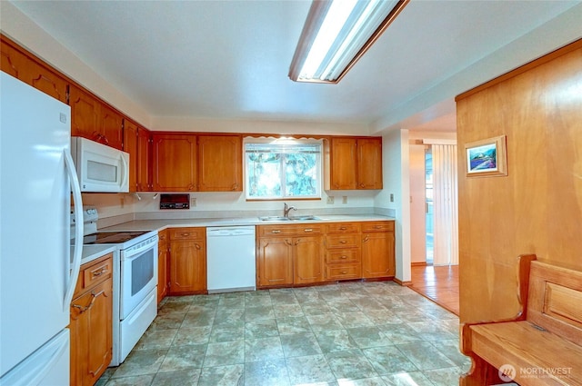 kitchen featuring sink and white appliances