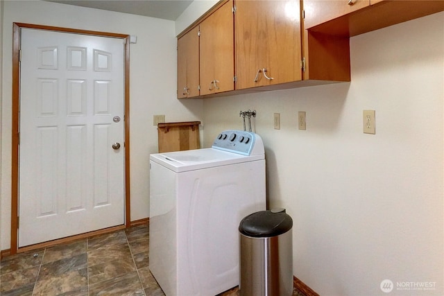 washroom featuring cabinets and washer / clothes dryer