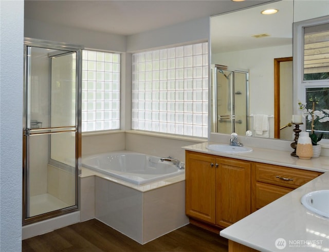 13315 Lost Lake Rd, Snohomish, WA 98296 - bathroom featuring vanity, visible vents, wood finished floors, a bath, and a shower stall