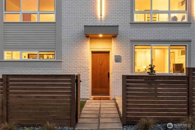 view of exterior entry featuring a garage