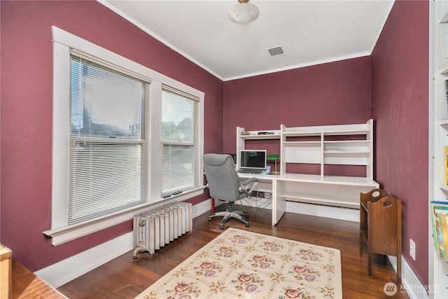 home office featuring radiator heating unit, dark wood finished floors, crown molding, and baseboards
