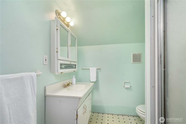 bathroom with vanity and toilet