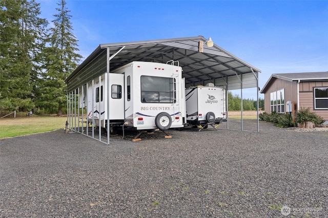 view of parking / parking lot featuring a detached carport and driveway