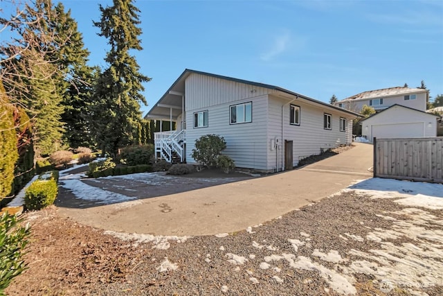 exterior space with an outbuilding and a garage