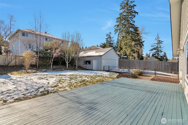 wooden terrace with a garage and an outdoor structure