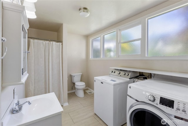205 S Division, Cashmere, WA 98815 - washroom featuring washing machine and clothes dryer, light tile patterned flooring, and baseboards