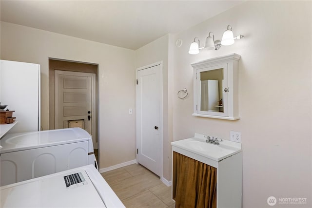 205 S Division, Cashmere, WA 98815 - bathroom with washer / dryer, vanity, and baseboards