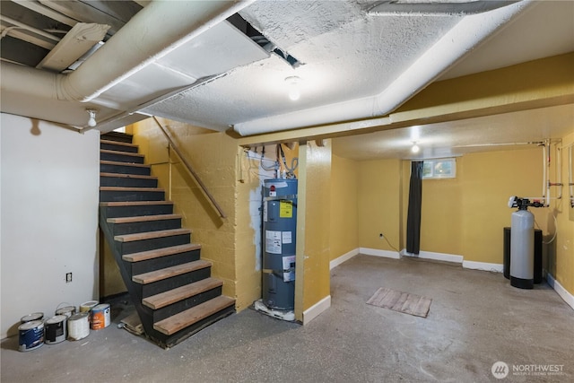 205 S Division, Cashmere, WA 98815 - basement featuring electric water heater, stairway, a water softener system, and baseboards
