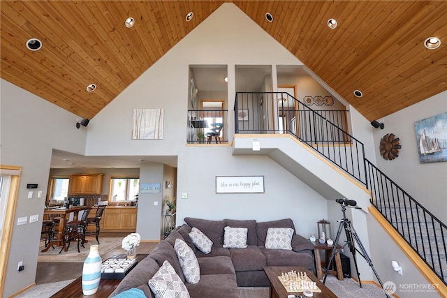 living room with high vaulted ceiling, recessed lighting, stairway, and wood ceiling